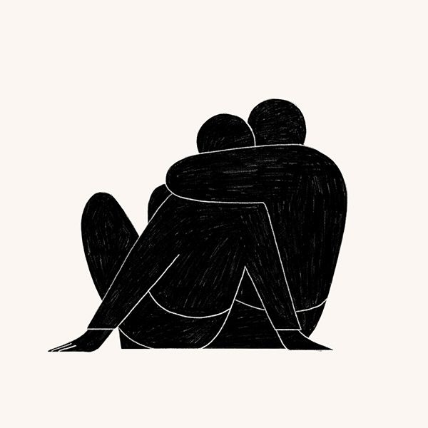 two people sitting on the ground with their backs to each other, one is hugging