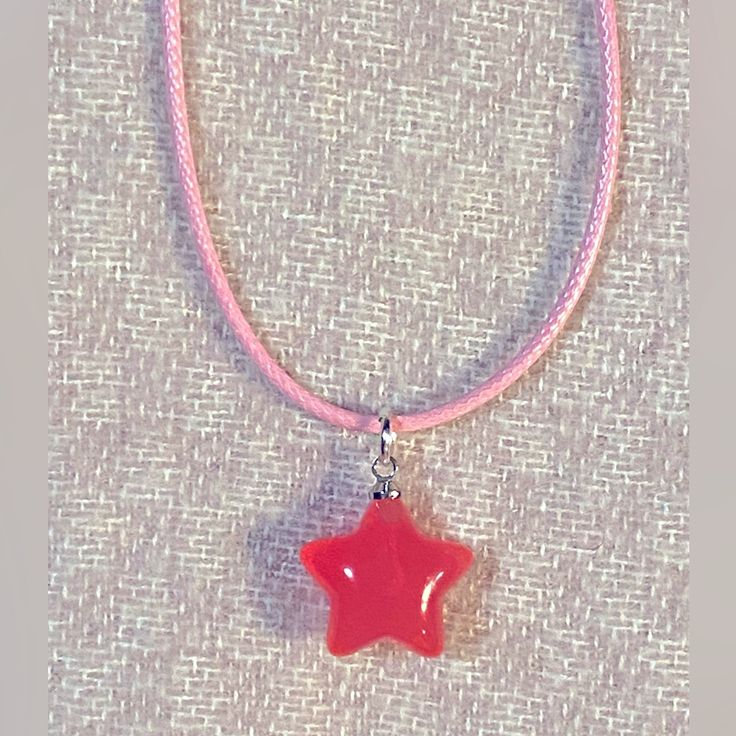 This Listing Is For A Cute “Pinkstar” Charm Necklace The 17” Necklace Is Made Of Pink Leather Necklace Cord. The Star Charm Is Made Of Resin And Has A Shiny Glowing Affect. Handmade Jewelry By Me, Amanda *Bundle & Save On Shipping With Anything On My Page! Pink Star-shaped Jewelry With Starfish Charm, Pink Star Jewelry With Starfish Charm, Trendy Adjustable Star Necklaces, Trendy Adjustable Star-shaped Necklace, Handmade Adjustable Star Necklace, Cute Handmade Star Jewelry, Trendy Pink Necklace With Star Charm, Cute Handmade Star-shaped Jewelry, Pink Star Charm Jewelry For Gift