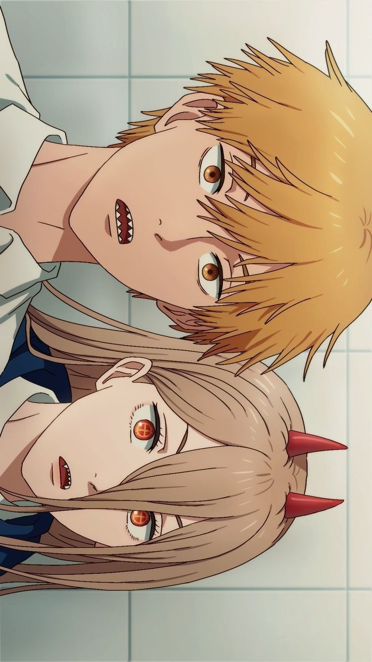 two anime characters with blonde hair and horns on their heads are staring at the camera