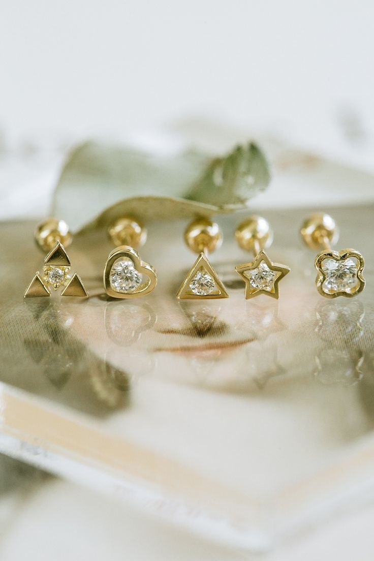 About Gold The most popular alloy of gold is 14K gold, which is 58.5% pure gold and 41.5% other metals like silver and copper. price is for 1qty( one piece), YOU WILL RECEIVE A SINGLE PIECE (NOT A PAIR , NOT TWO PIECES) 1. Triforce Type Material: 14K Real Gold, Whitegold Plated 14K Gold, 14K Real Rosegold Pendant Size(Motif Size): 5mm x 4.5mm Pin Size Length: 4mm, 6mm, 8mm, 10mm Pin Thickness: 0.7mm Color : 14K Gold, 14K WhiteGold, 14K Rosegold --------------------------------------------------- Gold Piercings With Diamond Accents In 14k Gold, 14k Gold Piercings With Diamond Accents, Yellow Gold Piercings With Diamond Accents For Gift, Dainty Gold Piercings With Diamond Accents, 14k Gold Cartilage Earrings With Diamond Accents, Dainty Gold-plated Piercings, Adjustable Gold Cartilage Earrings In Cubic Zirconia, Gold Diamond Accented Huggie Cartilage Earrings, Gold Cubic Zirconia Piercings For Gift