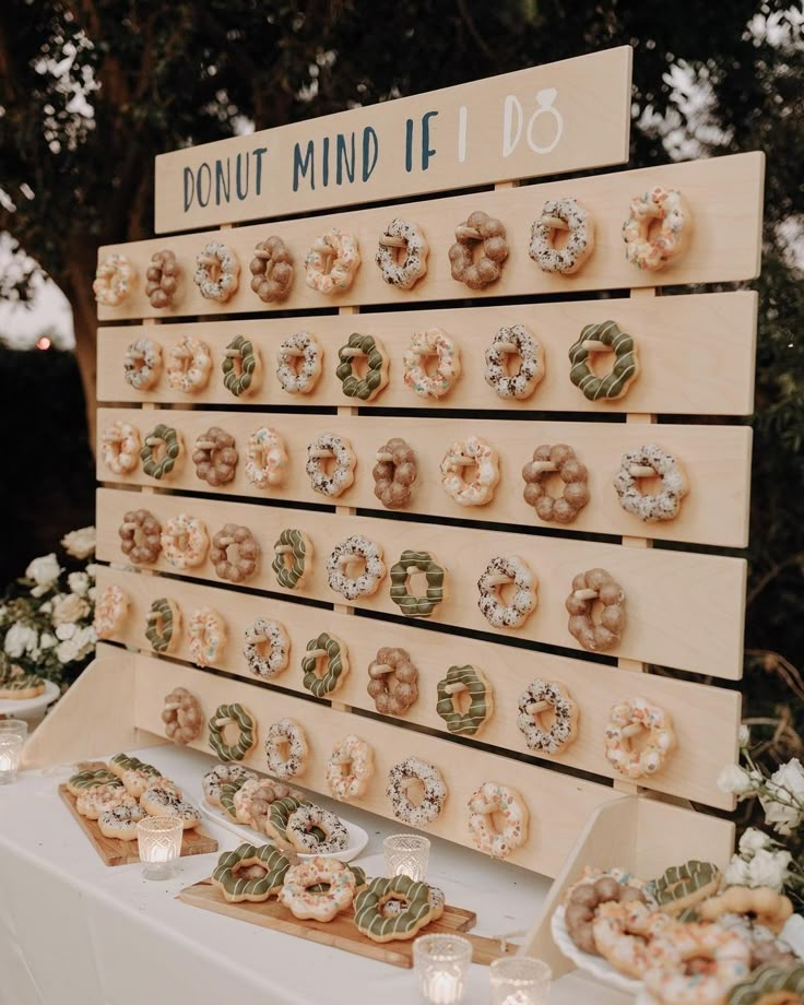 donuts are on display in front of a sign that says donut mind if do