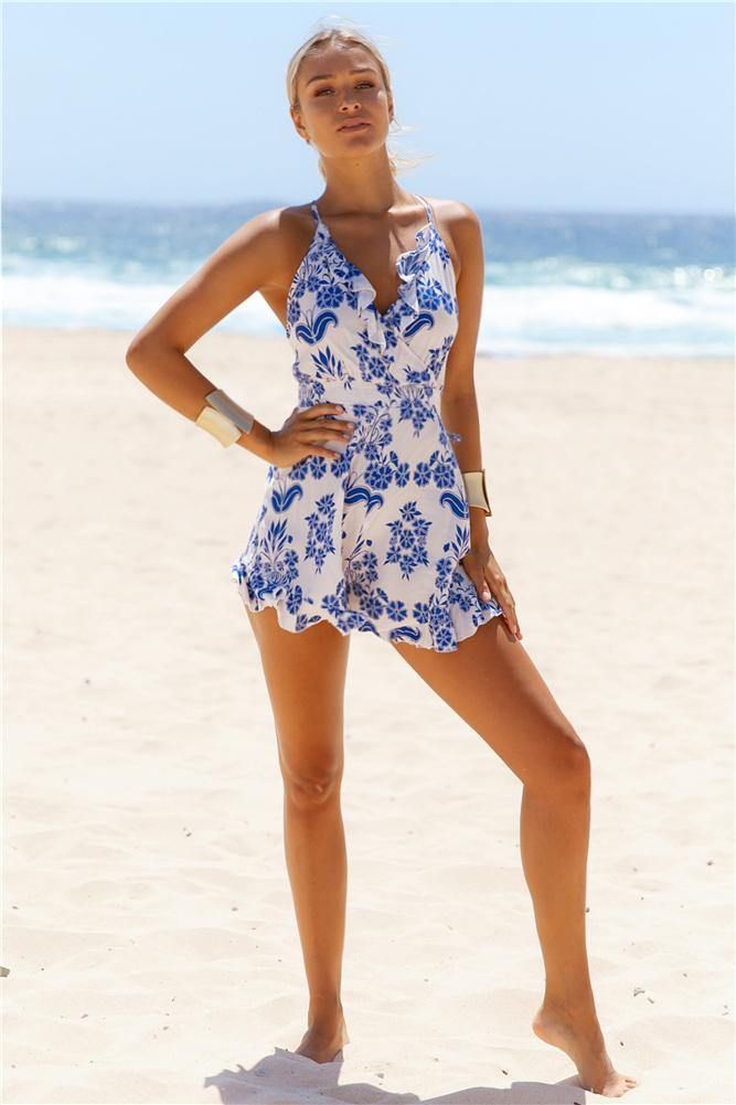 Soak up the sun in the Island Hop Romper! This cute one-piece is made from a lightweight, printed fabric and features a wrapover, ruffle front. The back is exposed with crossover straps that can be tied as desired. The floaty shorts are decorated with a ruffled hem. We love this with lace-up sandals for a perfect vacation outfit! Romper. Not lined. Cold hand wash only. Model is a standard XS and is wearing XS. True to size. Print placement may vary. Non stretchy fabric. Polyester. Soak Up The Sun, Vacation Outfit, Costume Intero, Print Placement, Lace Up Sandals, Vacation Outfits, Printed Fabric, Stretchy Fabric, Playsuit