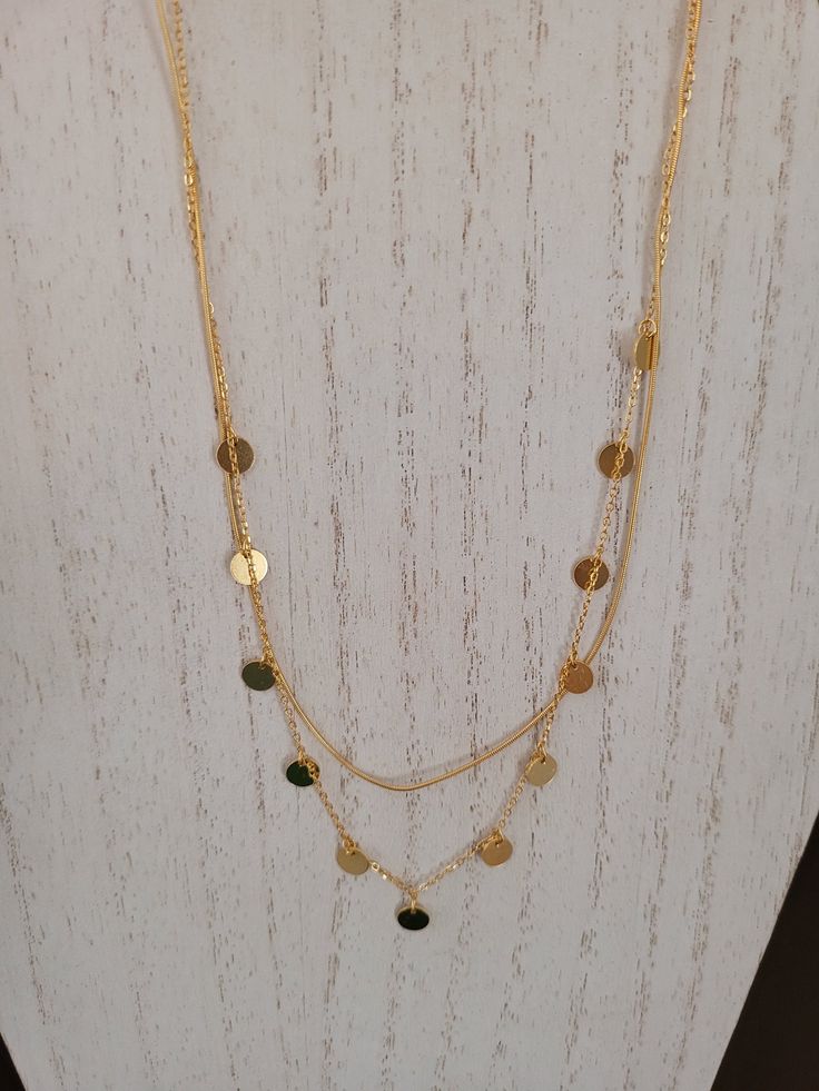 The necklace has two strands.  The 16 inch is 3mm wide with a solid design.  The second chain is 18 inches with 3mm open links and 20mm round disks.  Adjustable 16 to 18 inches.  18K gold plated/stamped 925. Gold Dainty Coin Necklace For Layering, Gold Double Strand Layered Necklace, Dainty Gold Coin Necklace For Layering, Gold-plated Double Chain Layered Necklace, Elegant Gold Coin Necklace With Double Chain, Elegant Gold Double Chain Coin Necklace, Gold Layered Double Strand Jewelry, Elegant Gold Layered Round Necklace, Gold-tone Double Strand Layered Necklace