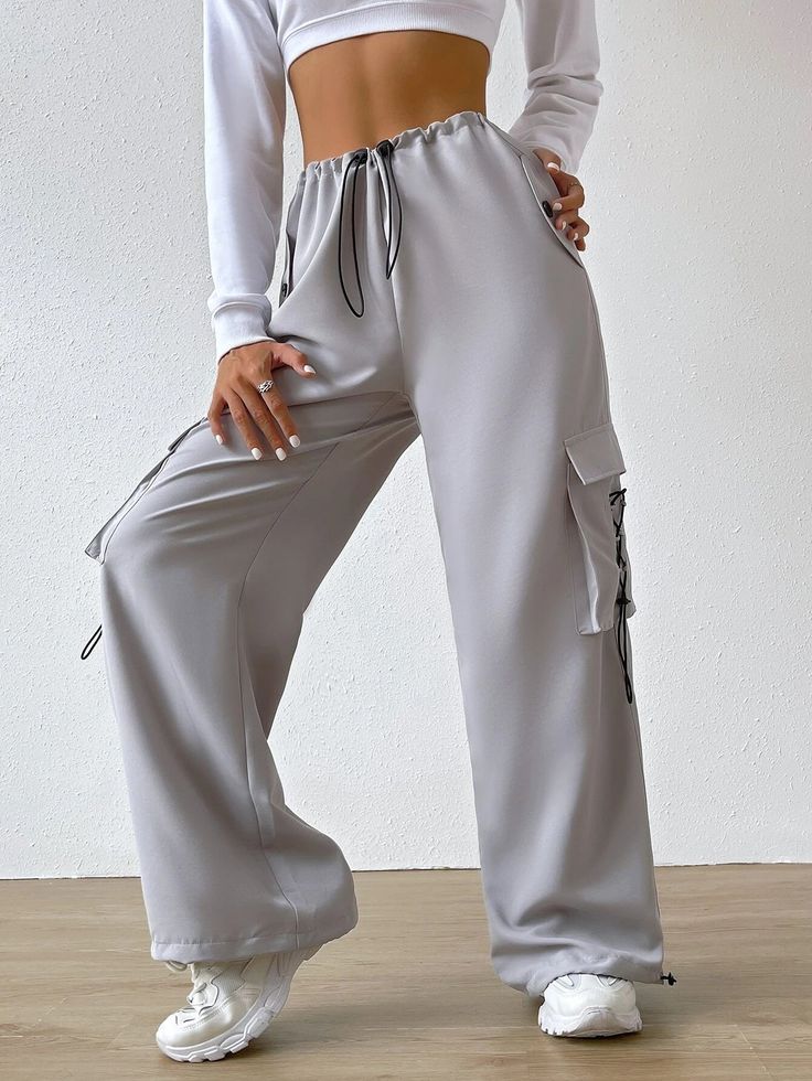 Experience the perfect blend of comfort and style with our Flap Pocket Waist Cargo Pants. These casual jogger pants in a trendy light gray shade are designed to elevate your fashion game. The extra-long length and regular fit ensure a flattering silhouette, while the drawstring and pocket details add a touch of functionality. Details: Color: Light Gray Style: Casual Pattern Type: Plain Type: Jogger Details: Drawstring, Pocket Length: Extra Long Fit Type: Regular Fit Fabric: Non-Stretch Material: Gray Ankle-length Streetwear Bottoms, Gray Ankle-length Pants For Streetwear, Gray Wide Leg Joggers For Spring, Gray Wide Leg Sweatpants With Drawstring, Spring Wide Leg Gray Joggers, Gray Wide-leg Sweatpants With Drawstring, Spring Wide-leg Gray Joggers, Baggy Gray Sweatpants For Spring, Gray Leisure Sweatpants With Side Pockets