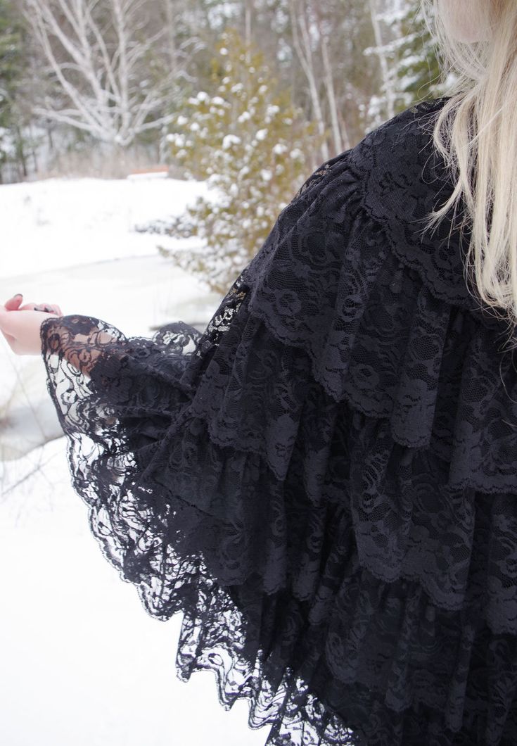 How many rows of lace can you count? Lady Lovelace herself would have been very proud of this striking and mind-stretching cloak. So many layers provide a winter option that is warm, romantic, and head-turning. The poly lining adds comfort and breathability. The cloak stays in place with the help of a satin ribbon in the front. One size. Hand/spot wash only. Each cloak is made in America by the Steampunk Threads team. Jeans and hat sold separately. Black Lace Outerwear With Lace Trim, Winter Lace Outerwear With Lace Trim, Fall Wedding Lace Outerwear, Edwardian Hat, Costume Capes, Ada Lovelace, Purple Plaid, Star Work, Womens Clothing Sizes