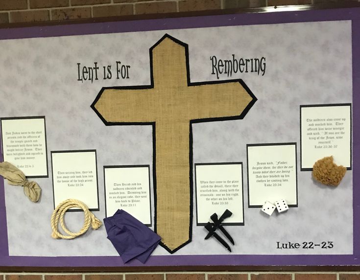 a bulletin board with a cross and other items