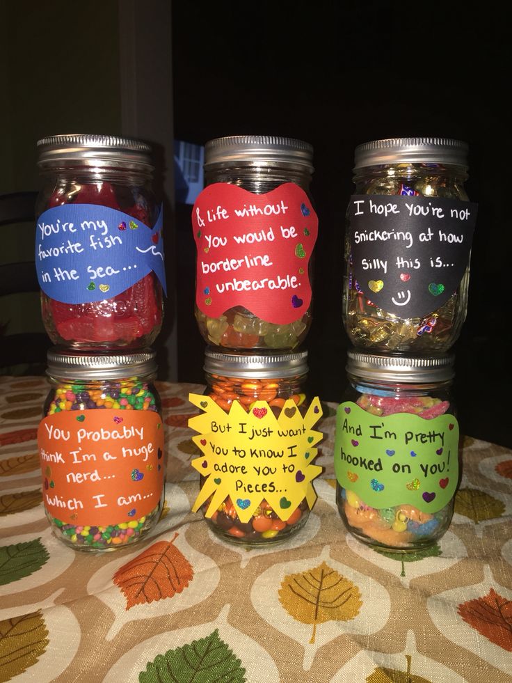 four mason jars filled with different types of valentine's day crafts for boyfriends