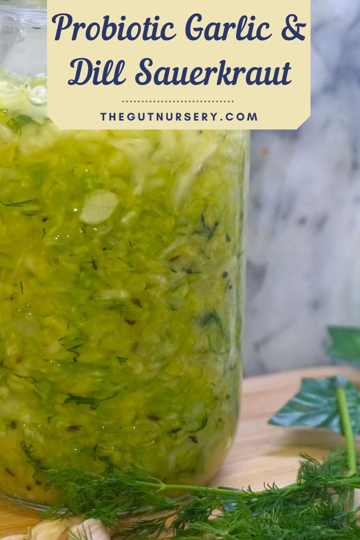 a jar filled with pickles and dilling on top of a cutting board