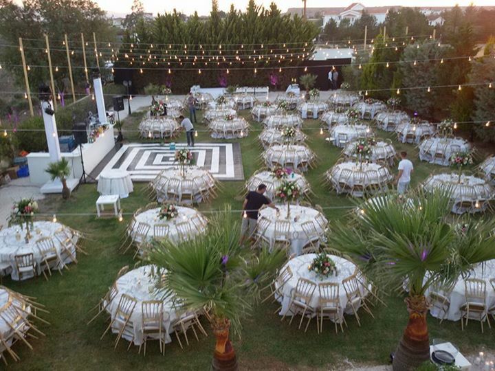 tables and chairs are set up on the lawn