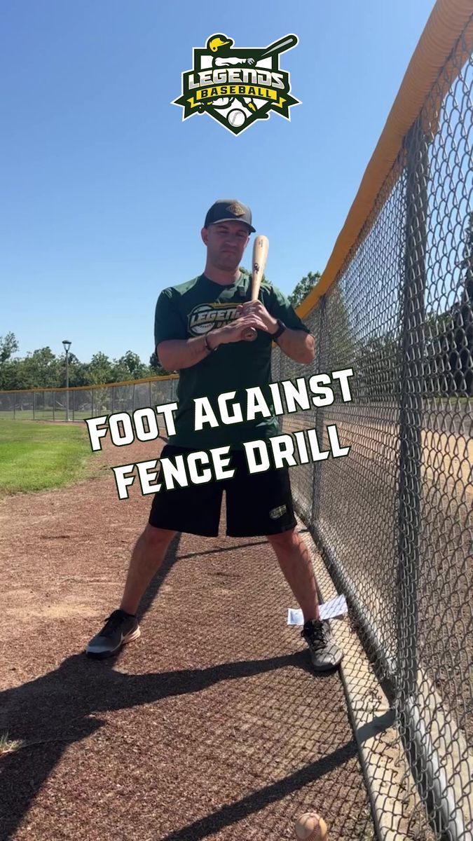 a young man holding a baseball bat on top of a batting cage with the words foot against fence drill in front of him