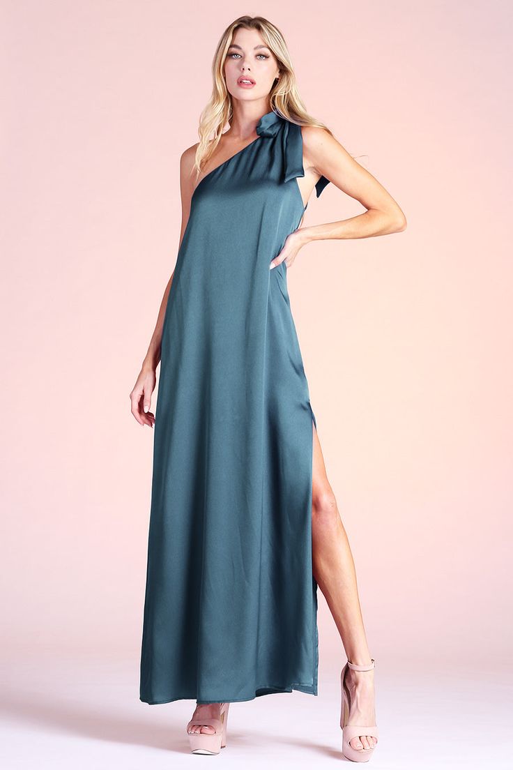 Hello GORGEOUS! This must-have maxi dress screams timeless glamour. The one shoulder neckline secures on the top of the shoulder with a cute tie closure that is adjustable to your liking. The shiny hammered satin fabric gives a slight shine as light hits you while wearing. The roomy body gives you freedom to wear as is or style with accessories. The piece finishes with lining and a vertical side slit. One shoulder neckline Adjustable tie on shoulder Shiny hammered satin finish Lined Sleeveless V Pine Green Dress, One Shoulder Maxi Dress, Trendy Boutique, All Black Everything, Maxi Dress Navy, Hello Gorgeous, Chic Boutique, Side Split, Satin Dresses