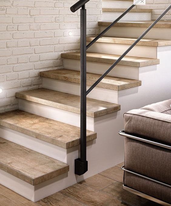 a set of stairs leading up to a living room