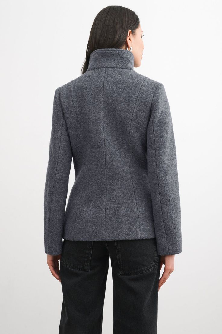 Handcrafted from 100% Italian virgin wool, our Essex offers pared-back contemporary styling in your new zip-up winter coat. Her off-center diagonal zipper fastens to create a high wrap neckline—structured enough to layer anything underneath comfortably (we've tested!). When worn open, by contrast, Essex offers artfully asymmetric lapels for additional visual interest. She's fully lined to keep you warm in cold temps and there are pockets to keep hands toasty, too.[SPLIT] Julia, in black and in m Coat Outfits, The A Team, Grey Women, Wool Jacket, High Collar, Black Coat, Wool Coat, Zip Up, Winter Coat