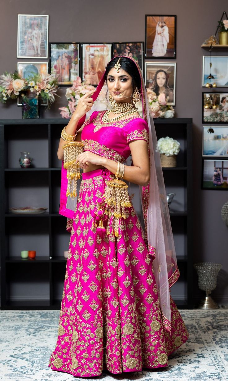 This beautiful set has an appeal of its own. Not just the bright magenta color, but the antique gold Zardozi work makes it so regal in look. Fully embroidered skirt paired with a blouse with embroidery on neckline and hemlines. Net dupatta with heavy borders and scattered bootis adds to the elegance. Embroidery is done with dabka, nakshi, zari french knots, and rich zircons. You have the option to change the color of the garment and make it according to your requirements. Please contact our Sale Zardozi Work, Curated Outfit, Add Sleeves, Magenta Color, Embroidery Materials, Computerized Embroidery, French Knots, Types Of Embroidery, Wedding Lehenga