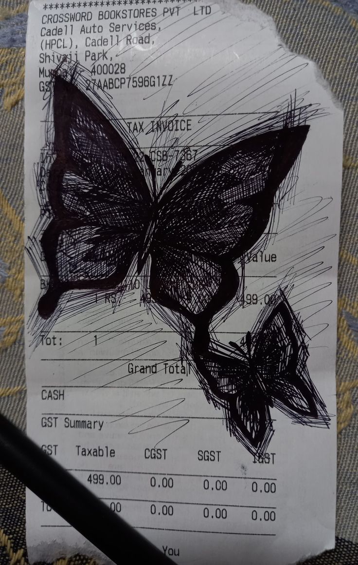 a piece of paper with a drawing of a butterfly on it