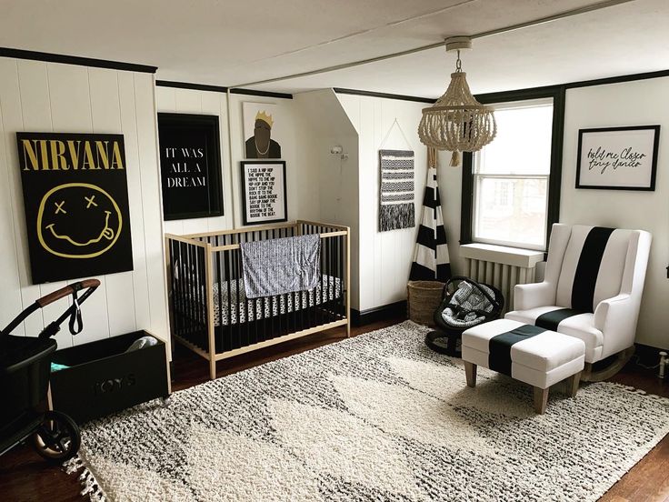 a baby's room is decorated in black and white