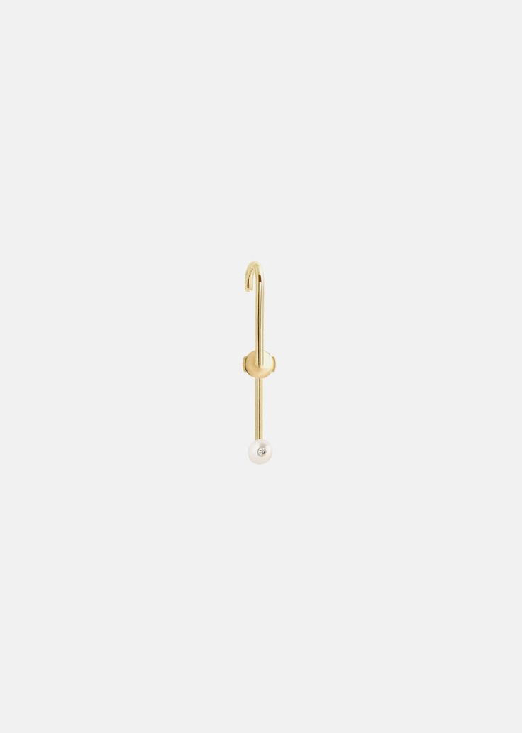 —The Ear Pin Collection A modern and minimal interpretation of a timeless and meaningful object, the safety pin. Our Petite Pearl Ear Pin© is crafted of polished 18k gold with a diamond set 4mm fresh water pearl. Inspired by the simplicity and elegance of the safety pin, our 'Ear Pin' is designed to be an illusion of a pin in your ear. A minimal graphic line that makes a distinctive yet timeless earring. 0.03ctw Diamond Grade: G color, VS clarity 1.25" in length Please note: All our pieces are m Gold Safety Pin Earrings For Everyday, Trendy Single Safety Pin Earring, Elegant Yellow Gold Safety Pin Jewelry, Minimalist Gold Safety Pin Earrings, White Clip-on Pearl Earrings Fine Jewelry, Minimal Graphic, Ear Pin, Ear Pins, Fresh Water Pearl