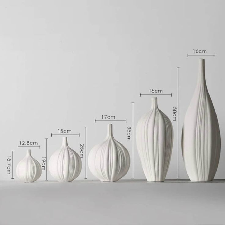 four white vases are shown with measurements for each one