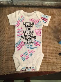 a baby's bodysuit with writing on it