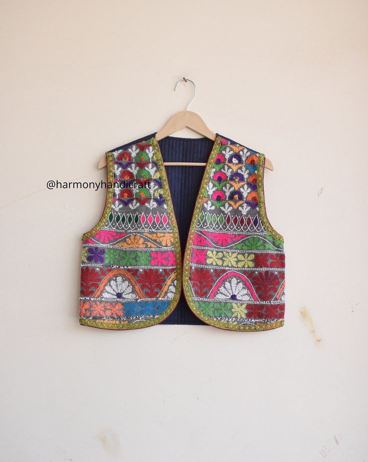 HARMONYHANDICRAFTCO presenting beautiful vintage banjara vest, It's reversible jacket which means you can wear this by both side.  Buy it for the holidays! Looks fabulous over a long silk tank dress or palazzo pants. Or wear it with jeans and boots. The design of the jacket is very unique and very rare. Indian culture and associated with grace and beauty. This Is A Gorgeous Piece Of Cotton Kantha Stitched jacket. Perfect Gifts For Your Beloved.. What Are You Waiting For? Add This Item To Cart, Buy Now And Surprise Your Loved Ones! Measurements Approx : S/M Length - 18 Inches Chest - 38 Inches Shoulder - 14.5 Inches Fabric - 100% Cotton Banjara vest, banjara sleeveless jacket, quilted vest, quilted jacket,embroidery vest, Indian kantha jacket, Kantha waistcoat, Reversible kantha jacket boho Vest Handmade, Boho Vest, Kantha Jacket, Boho Jacket, Reversible Vest, Embroidery Motifs, Sleeveless Jacket, Quilted Vest, Jacket Vintage