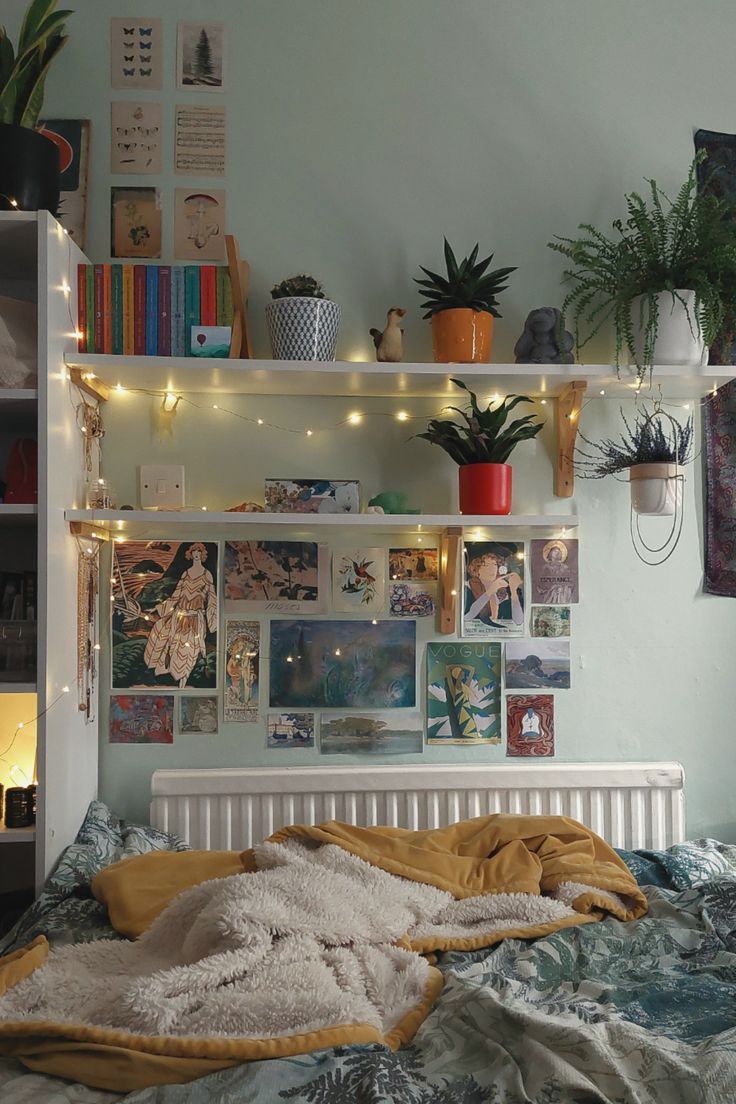 a bed room with a neatly made bed and lots of plants