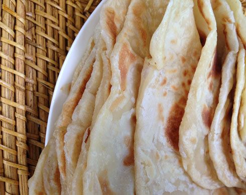 there are some pita breads on the plate