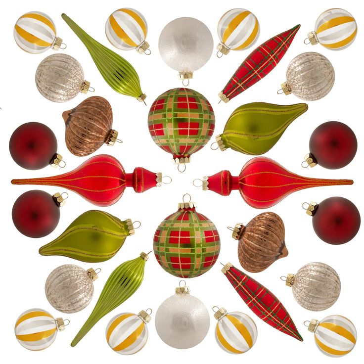 a circular arrangement of christmas ornaments in red, green and gold colors on a white background