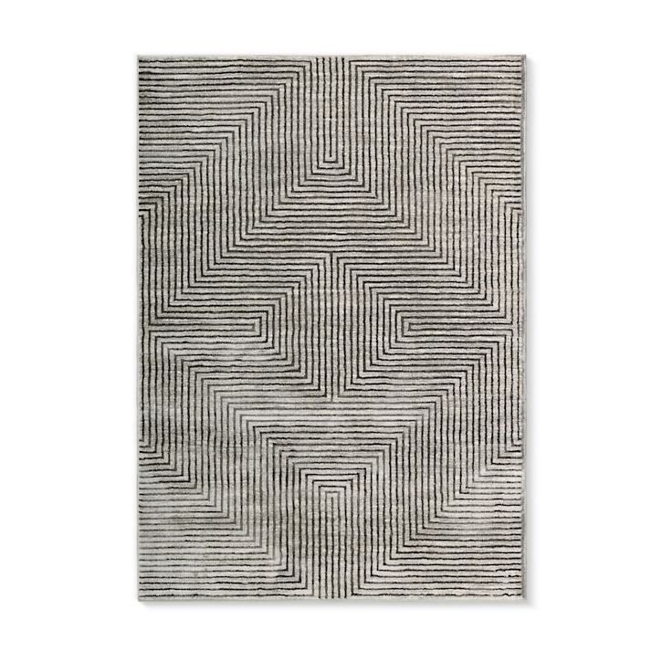 a black and white rug with wavy lines