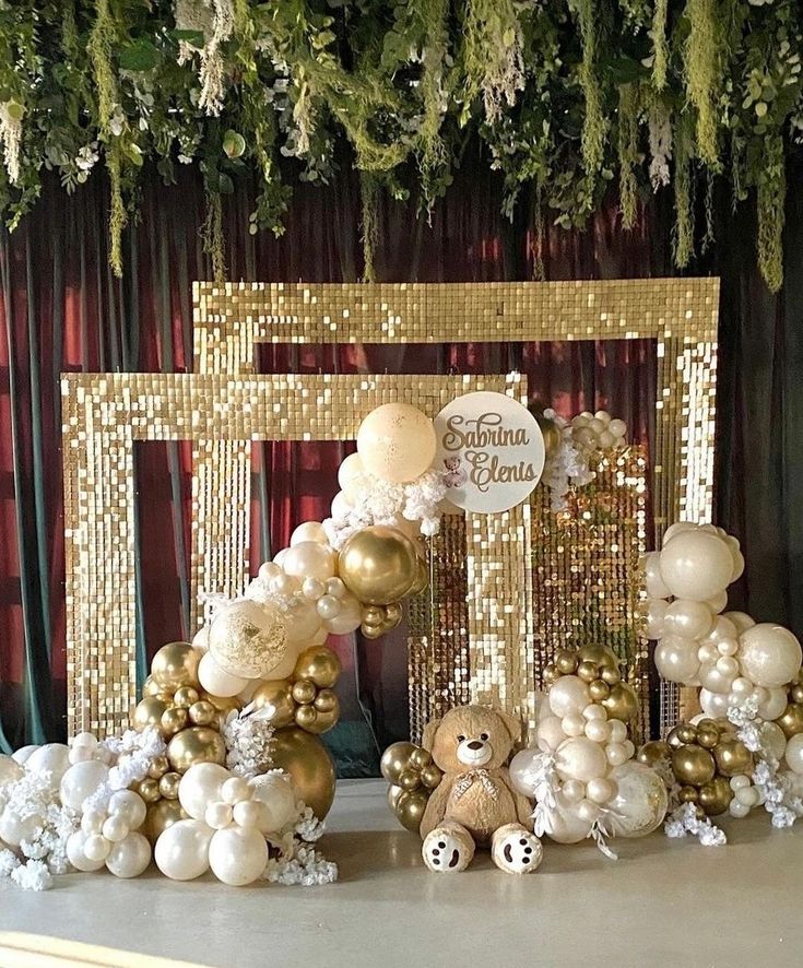 a table topped with balloons and teddy bears