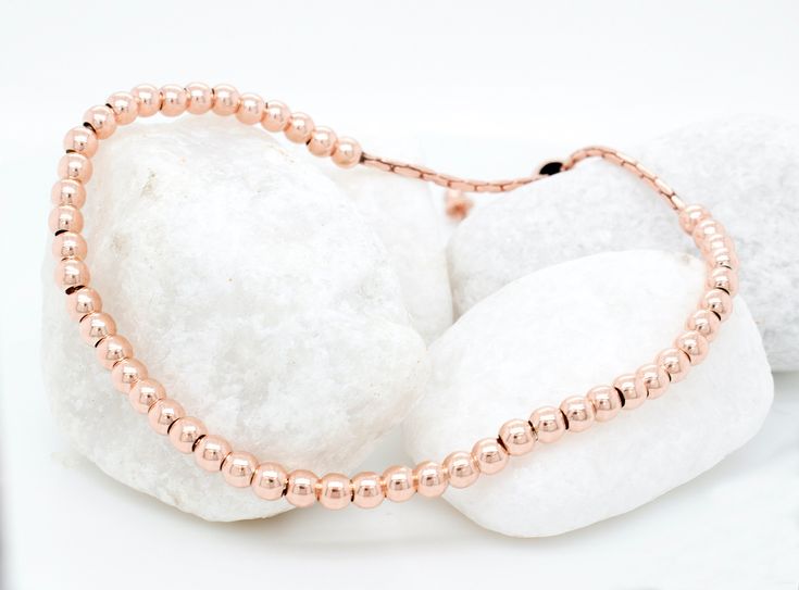 "For a charming addition to her collection, consider this 14k rose gold plated beaded ball bracelet, perfect for stacking and layering. Whether as bridesmaid jewelry or a thoughtful gift idea for her, it exudes dainty elegance, ideal for those who appreciate delicate bead jewelry. 𝐃𝐄𝐓𝐀𝐈𝐋𝐒 💎 1 bracelet, included 💎 Material: Sterling Silver, 14k Rose Gold Plated 💎 2mm: bead size 💎 Adjustable 𝐇𝐎𝐖 𝐓𝐎 𝐎𝐑𝐃𝐄𝐑 1. Select the color of the bracelet 2. Select the thickness 3. Select des Minimalist Rose Gold Beaded Bracelets As Gift, Dainty Rose Gold Stackable Bracelets, Stackable Rose Gold Beaded Bracelets, Rose Gold Beaded Bracelets As Gift, Hypoallergenic Dainty Rose Gold Beaded Bracelets, Rose Gold Stackable Beaded Bracelets, Round Hypoallergenic Rose Gold Bracelets, Hypoallergenic Round Rose Gold Bracelets, Hypoallergenic Rose Gold Beaded Bracelet Gift