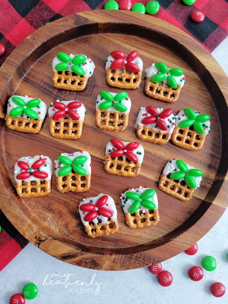 a wooden plate topped with mini waffles covered in frosting and bowknots