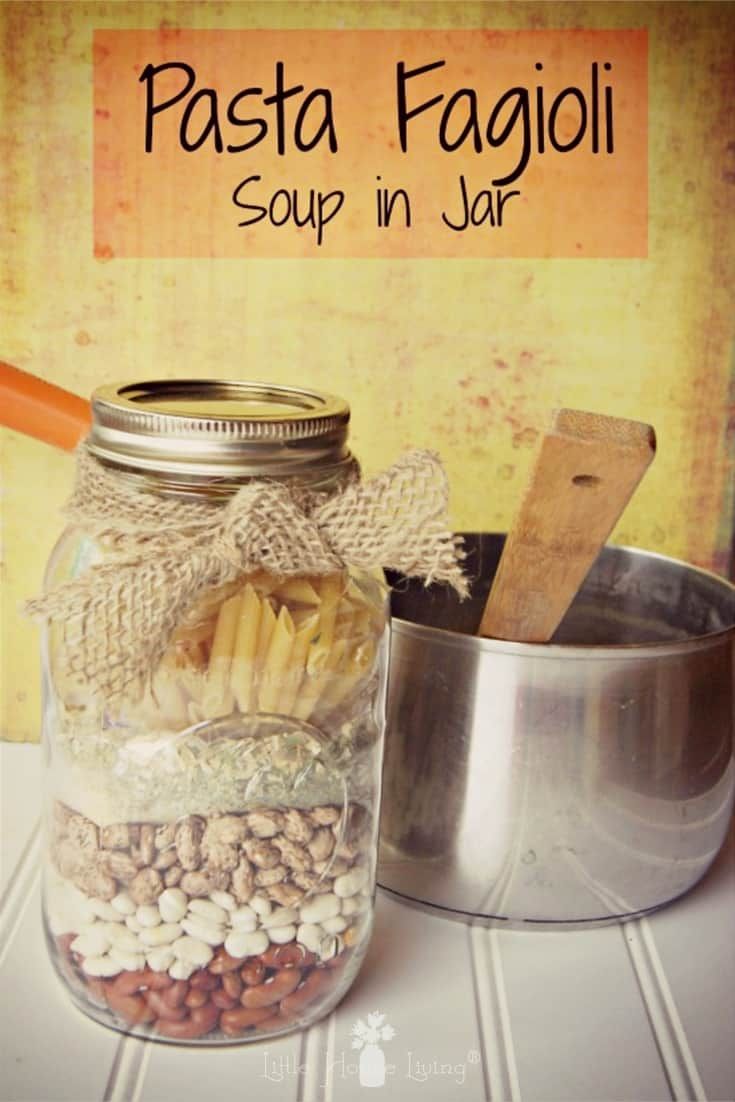 a jar filled with lots of food sitting on top of a table next to a pan