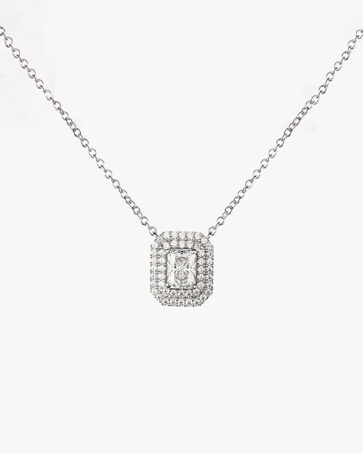 - Princess cut gemstone with Surrounding round cut stones Necklace- Made in Sterling silver set with a high-quality Cubic Zirconia. - Stone size: Princess cut 5.00 x 7.00 mm, Round cut 1.10 mm- Size : 12 x 14 mm ( 0.47 x 0.55 inch )- Chain length : 16 inch Sterling silver925 Sterling Silver is an alloy made of 92.5% pure silver and 7.5% copper. We plate our silver jewelry in rhodium, which gives it extra shine and durability. Rhodium is one of the costliest precious metals due to its rarity.Care Elegant Silver Necklace With Lab Grown Diamond, Formal Silver Diamond Chain Necklace, Silver Crystal Jewelry With Single Cut Diamonds, Silver Necklace With Round Cut Lab Grown Diamond, Classic Silver Necklace With Lab Grown Diamonds, Silver Diamond-cut Necklace, Elegant Oval Pendant Jewelry With Single Cut Diamonds, Classic Silver Lab Grown Diamond Necklaces, Classic Cubic Zirconia Diamond Necklace With Emerald Cut