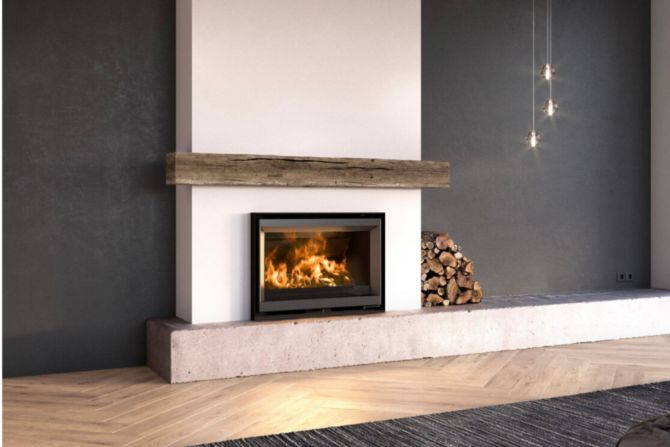 a fire place in a living room next to a fireplace with logs on the floor