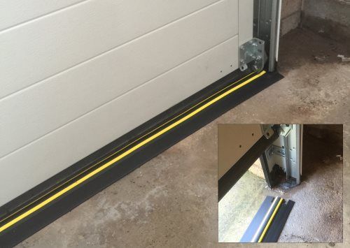 an image of a door that has been taped to the side of a building with yellow lines on it