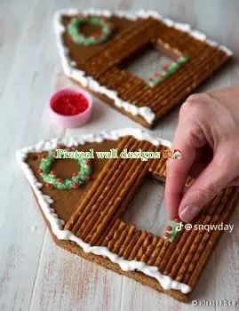 someone is decorating their gingerbread house with icing on the top and bottom