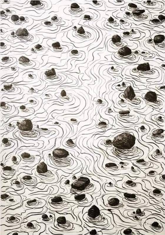 an image of water with rocks in the middle and ripples on it's surface