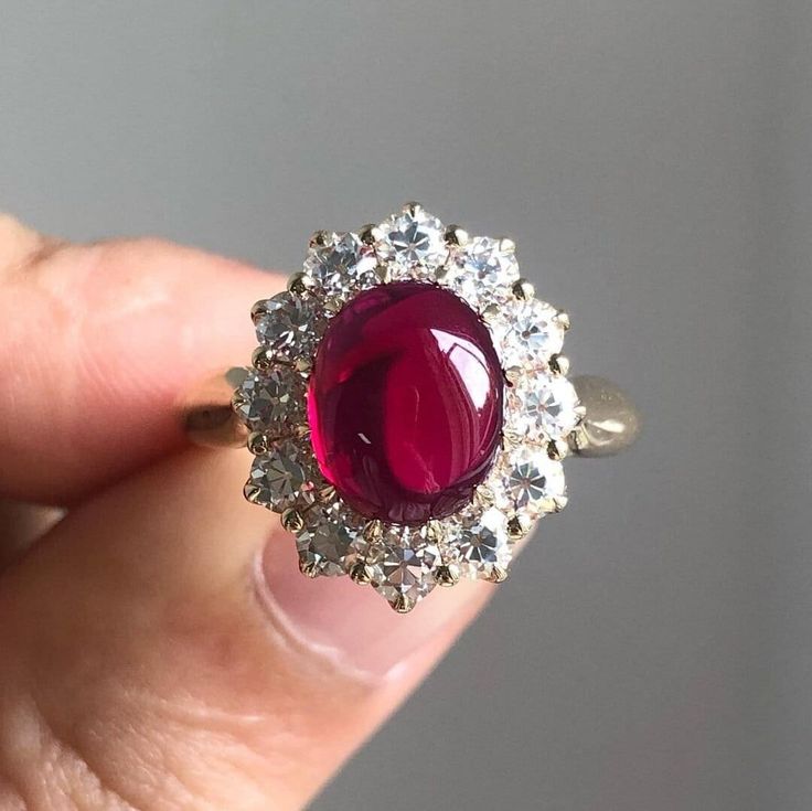 14K Gold Ring Lab Create Oval Cut Engagement Ring Red Ruby Ring Halo wedding Ring Ruby Cabochon Anniversary Ring Promise Ring Gift For Her. ♣ Stone Details ☛ Stone: 10 MM x 8 MM Oval Cut  (Ruby Cabochon) ☛ Side Stone: 1.20 CTW Round Cut Moissanite  ☛ Band Width: 3.60 mm ☛ Stone Color (Red/White) ☛ Clarity - VVS1 ☛ Luster: Excellent ☛ Make: High Quality ☛ Center Shape: Oval Cut ☛ Metal Change(10k/14k/18k White/Yellow/Rose Gold) ☛ Handmade item ★ Moissanite Guarantee :   Test By Diamond Tester Its Test Show Positive 100% I accept custom making order. please contact me if you need this service. All the jewelry in my store is handmade .it may take 2-3 weeks to finish. ♣ Buy with Warranty: ☛ 14 Days Money Back Guarantee; ☛Excellent Customer Service; ☛  Free Shipping and insurance WORLDWIDE; ☛ F Wedding Ring Ruby, Red Ruby Ring, Rose Gold Diamond Ring Engagement, Oval Cut Engagement Ring, Ring Halo, Promise Ring Gift, Wedding Rings Halo, Ruby Engagement Ring, Ruby Jewelry