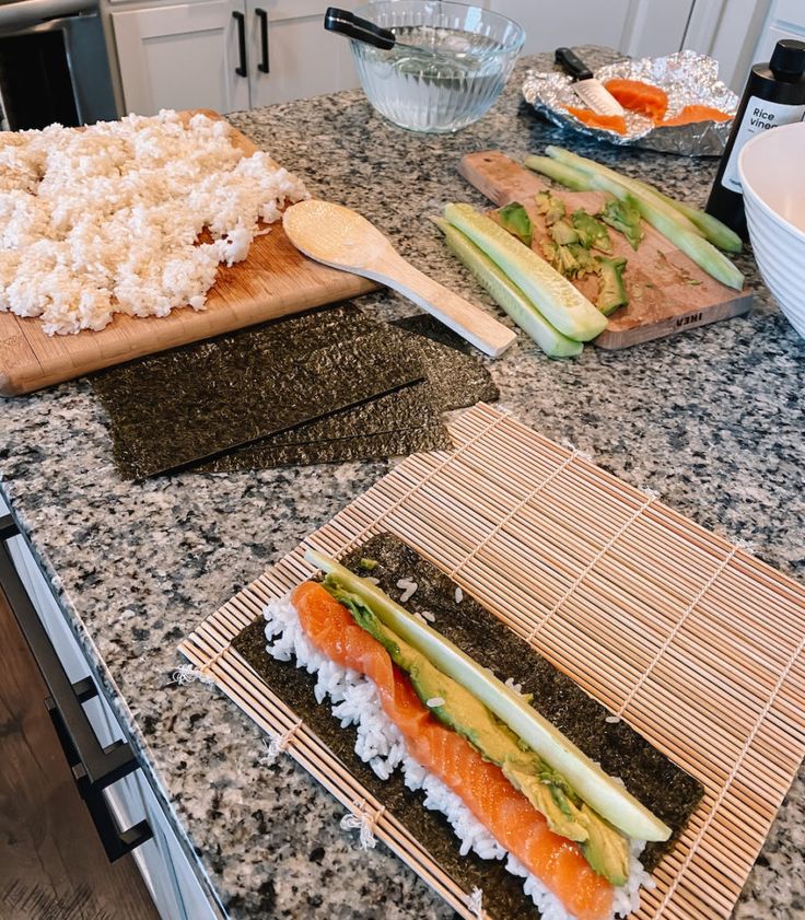 there are sushi and rice on the counter in the kitchen, along with other ingredients