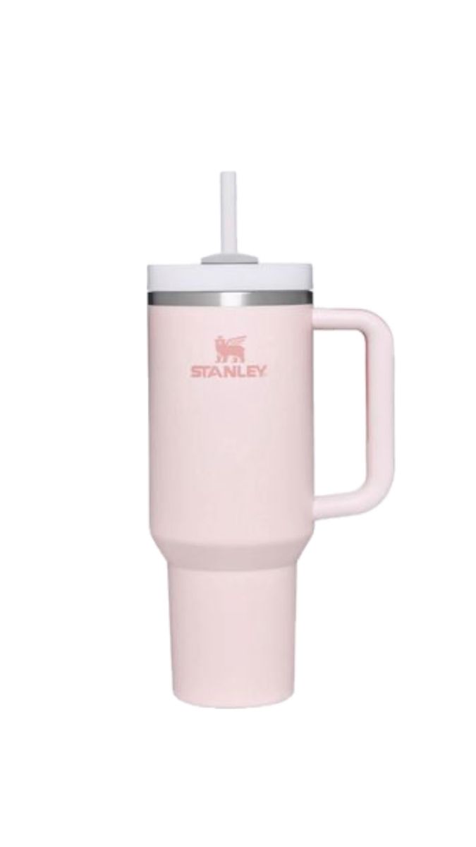 the stanley travel mug is pink and has a straw in it's cup handle