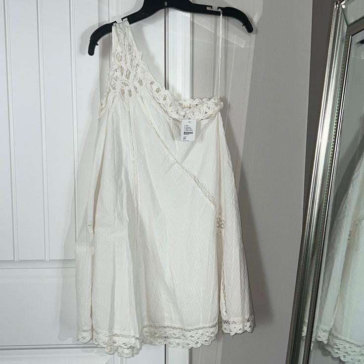 Free People Dress, Brand New, Never Worn. Color Is Ivory. Has A Tiny Loose Thread As Shown In Pic. Paid Full Price From The Free People Store. White One-shoulder Lace Dress, White One-shoulder Mini Dress For Beach, White One-shoulder Mini Dress For Spring, Casual White One-shoulder Mini Dress, White Bohemian One-shoulder Dress, White One-shoulder Bohemian Dress, Bohemian White One-shoulder Dress, Bohemian One-shoulder White Dress, Free People Store