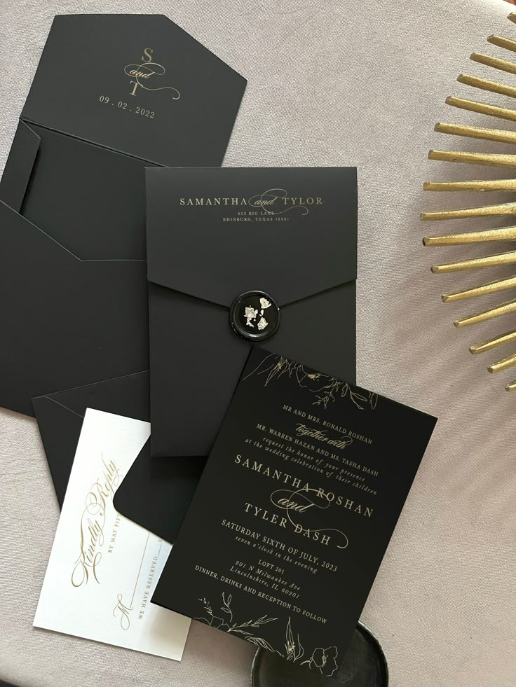 black and white wedding stationery with gold foiling on the front, back and inside