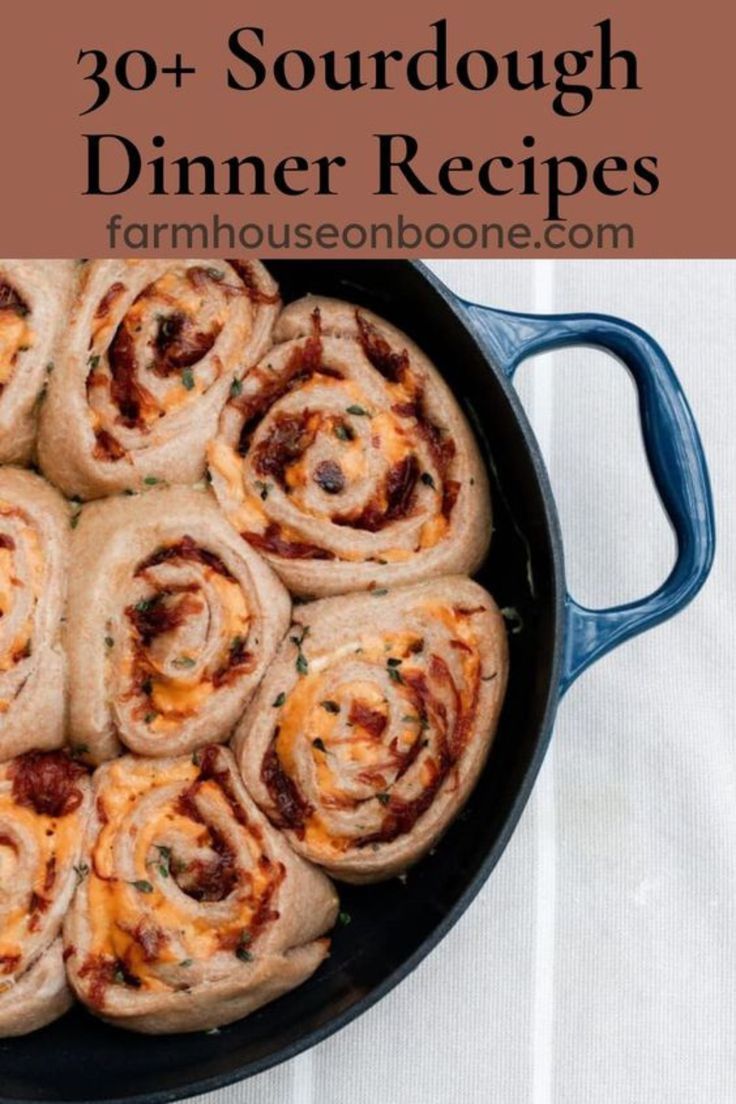 a skillet filled with meat and cheese rolls on top of a white tablecloth