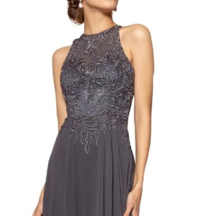 Effortlessly Beautiful Dress By Elizabeth K Gl2680. This Dress Has A Floral Lacework On The Bodice With A Natural Waistline And A-Line Silhouette. It Has A Jewel Neck And A Closed Illusion Back With A Hidden Zipper. Formal Sleeveless Mother Of The Bride Dress, Gray Sleeveless Evening Dress, Elegant Gray Formal Dress, Gray Sleeveless Gala Dress, Fitted Sleeveless Gray Evening Dress, Fitted Gray Dress For Gala, Gray Fitted Sleeveless Evening Dress, Elegant Gray Embellished Dress, Gray Embellished Evening Dress