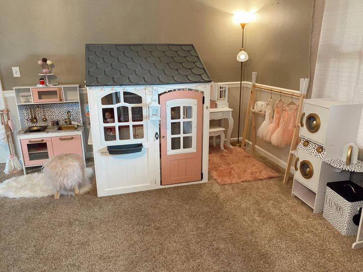 a doll house with furniture and accessories in it