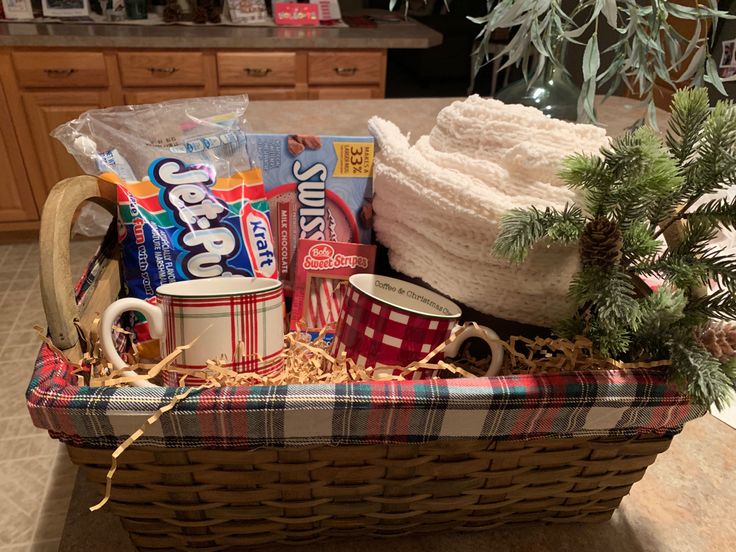 a basket filled with coffee and snacks on top of a counter