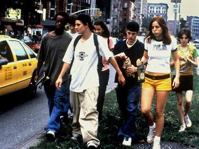 a group of young people walking down a street next to a yellow taxi and tall buildings