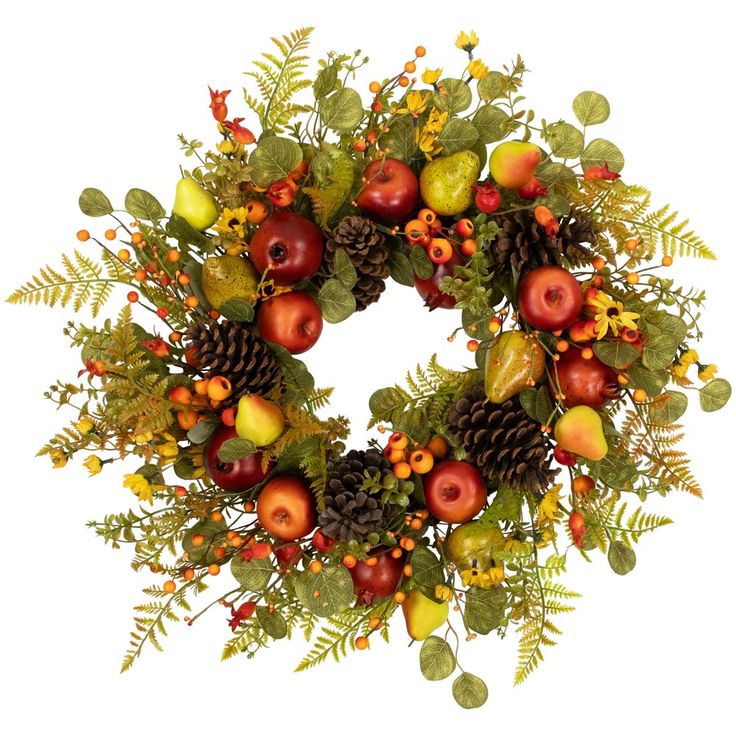 a wreath made up of apples, leaves and pine cones on a white background with autumn foliage