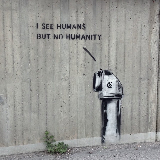 graffiti on the side of a building that says i see humans but no humanity