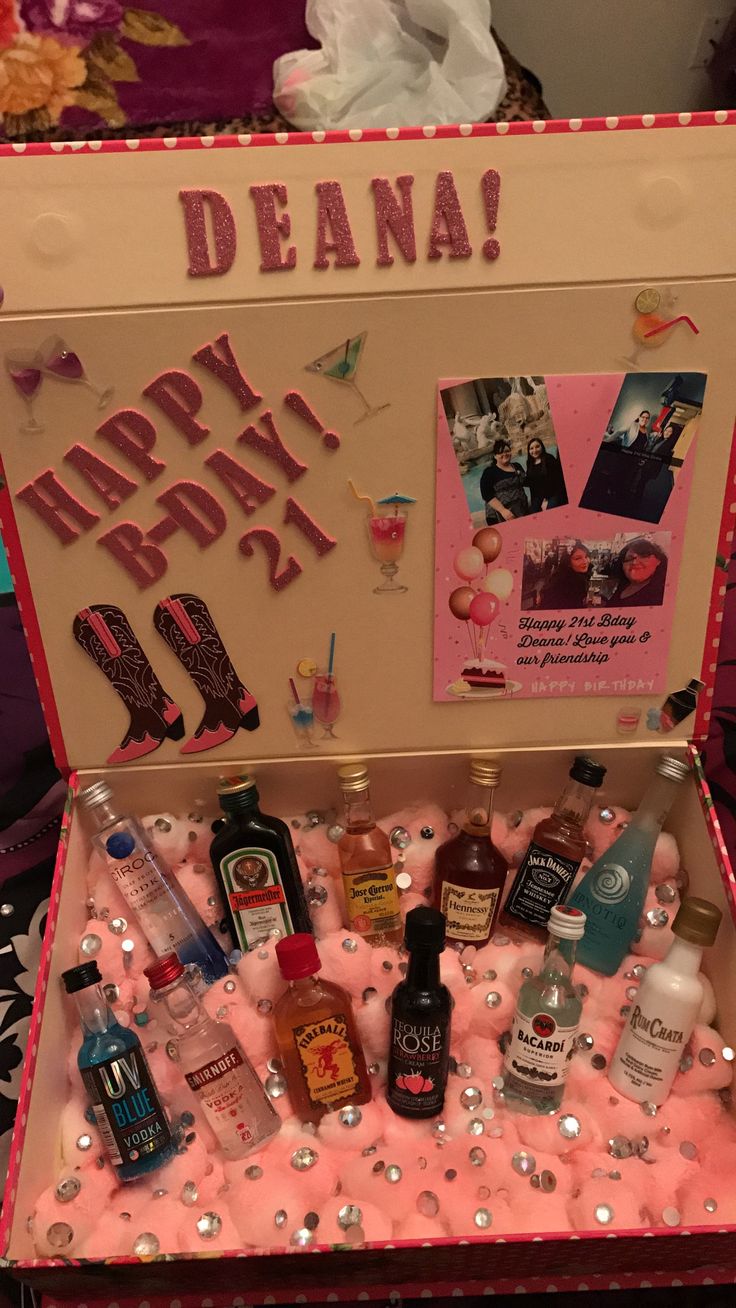 an open birthday box filled with liquor and confetti